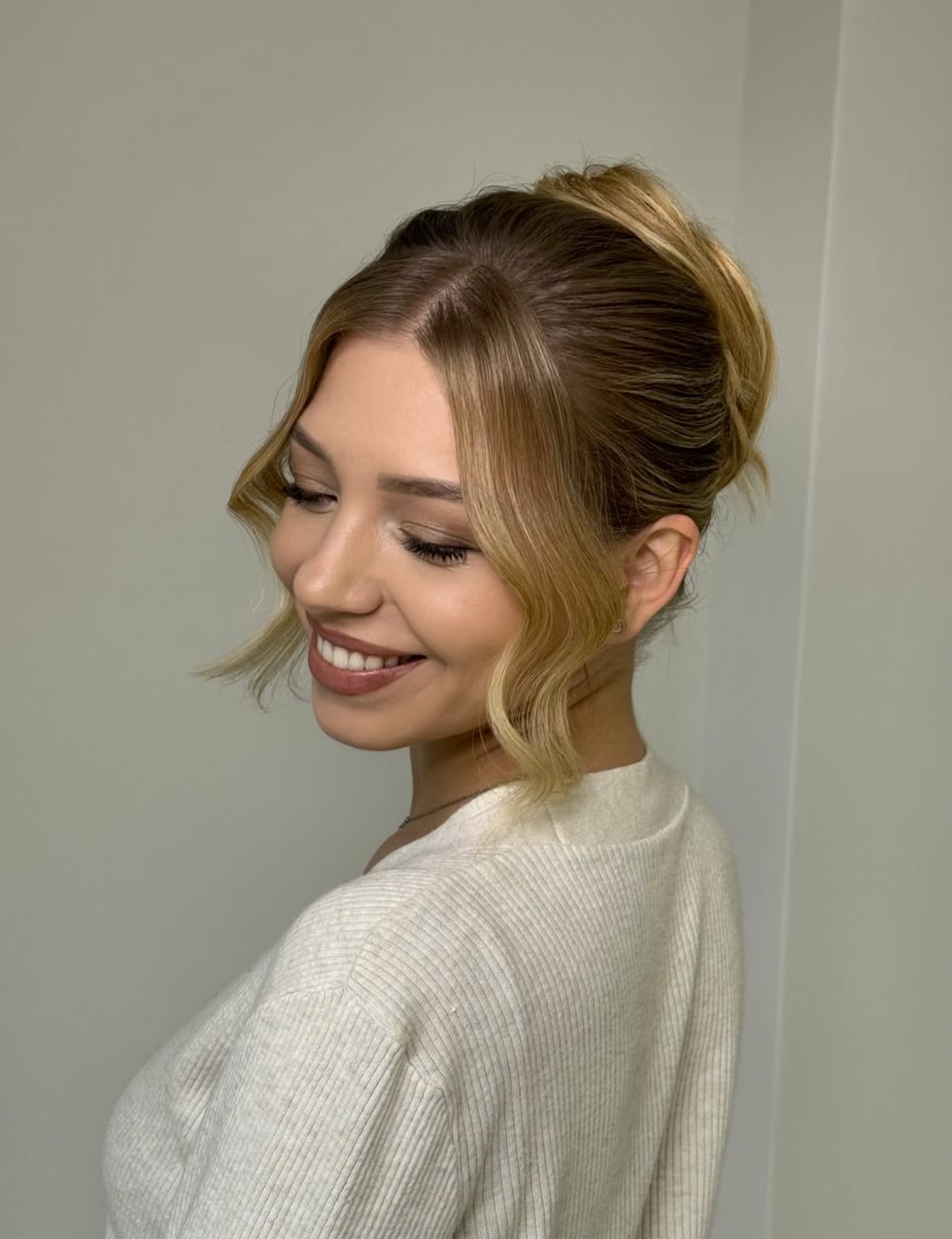 Relaxed updo with soft, warm bridal tones